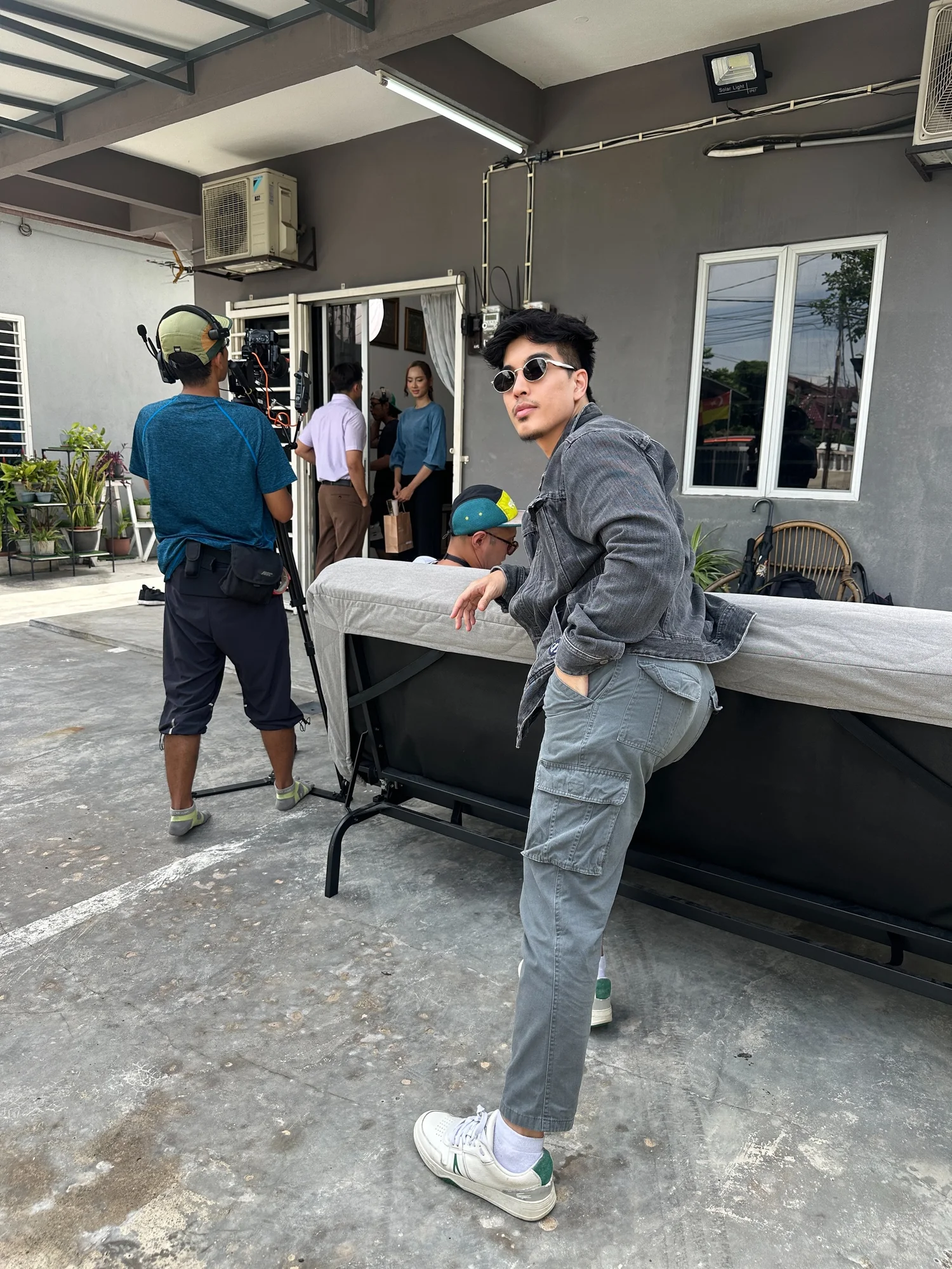 Talent and production team preparing a scene on location